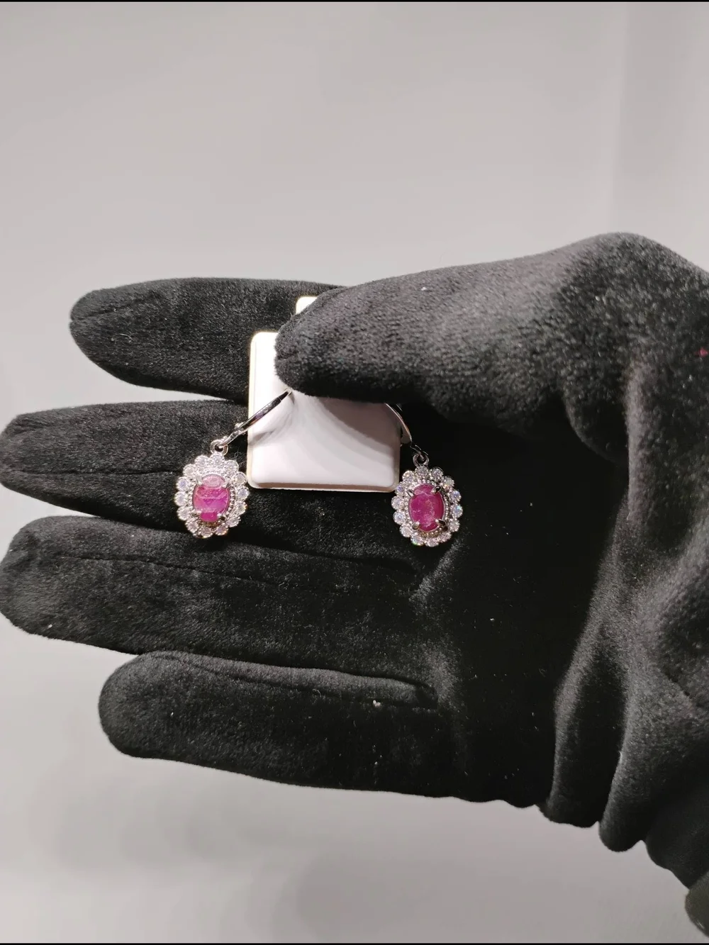 Ruby and Cuban Zirconia earrings oval gemstone surrounded by smaller clear stone